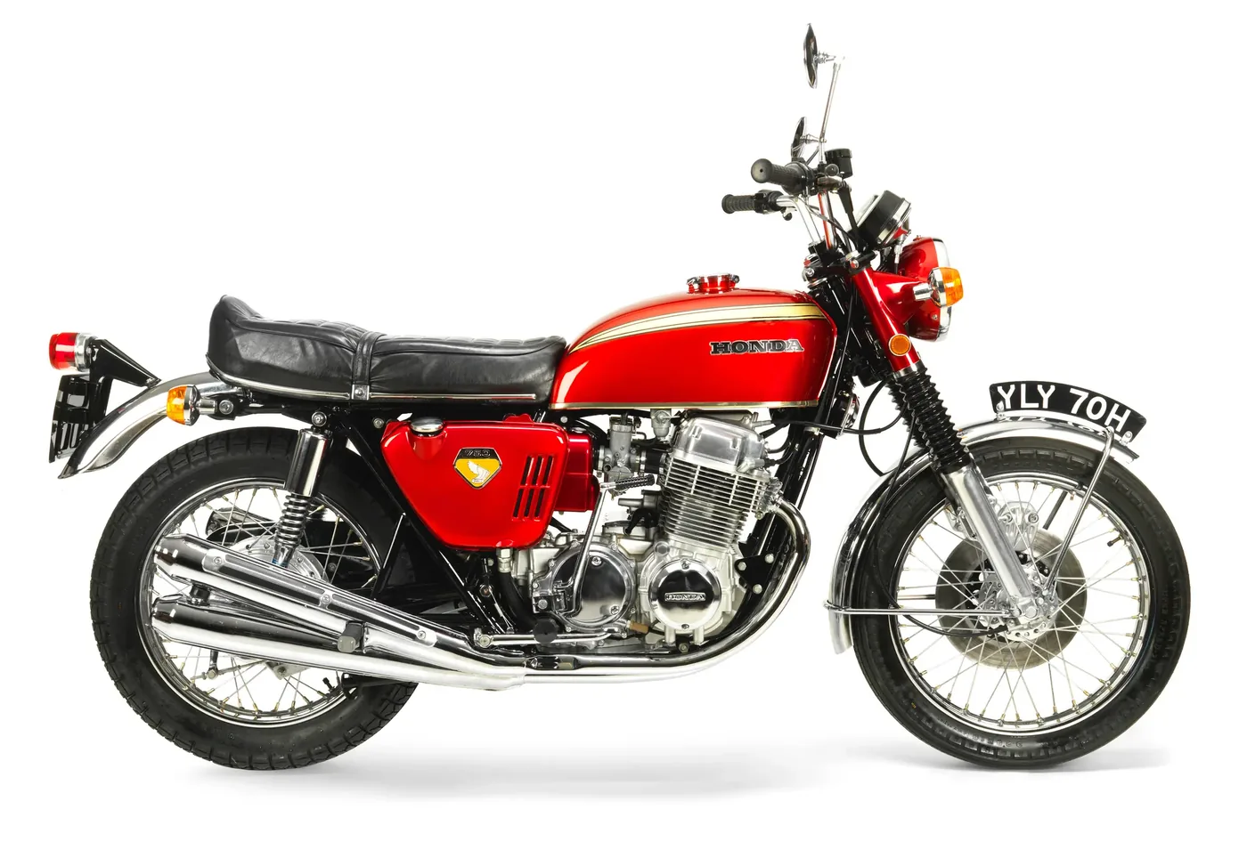 Fully restored red Honda CB750, studio photo